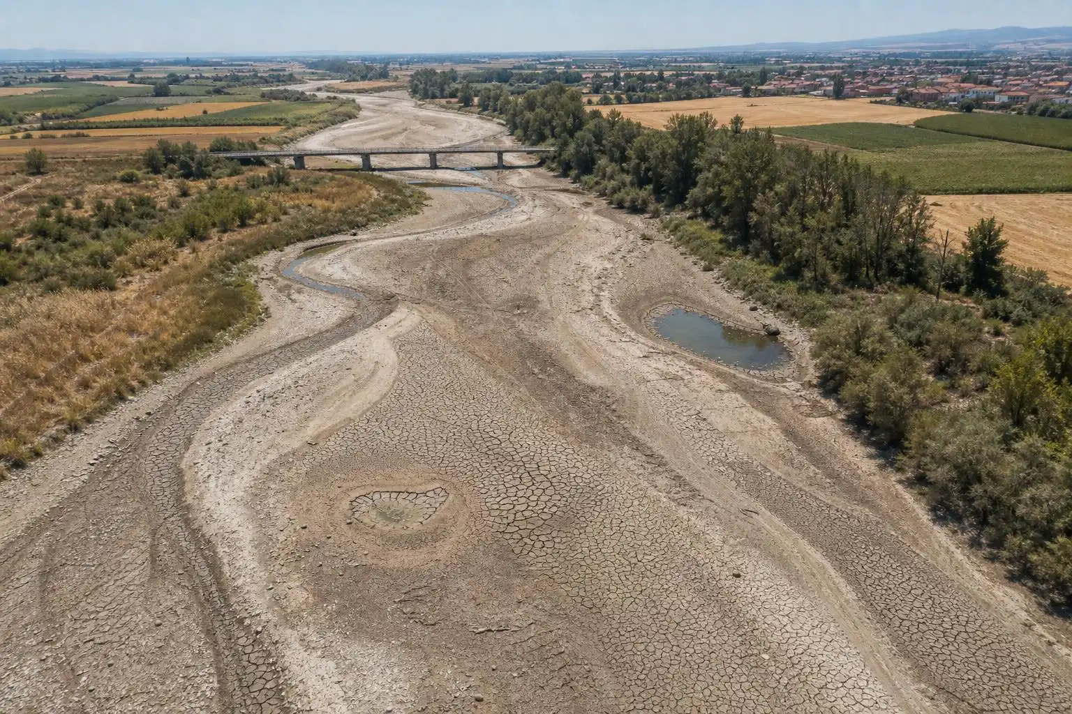 Cracked riverbeds across central Europe became a defining image of the summer of 2026.